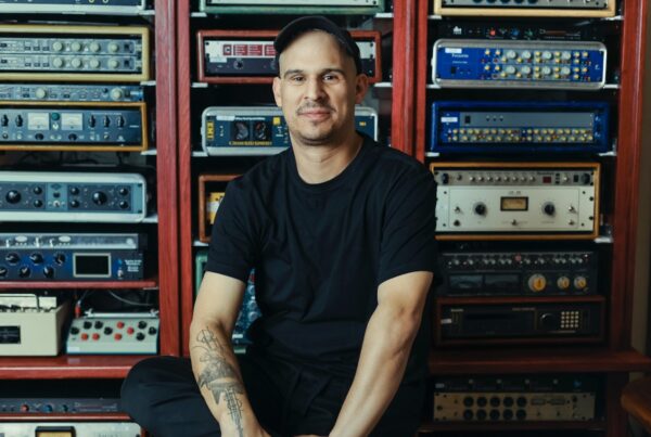 Justin Moshkevich at Igloo Music in front of outboard gear. Photo credit by David Vega