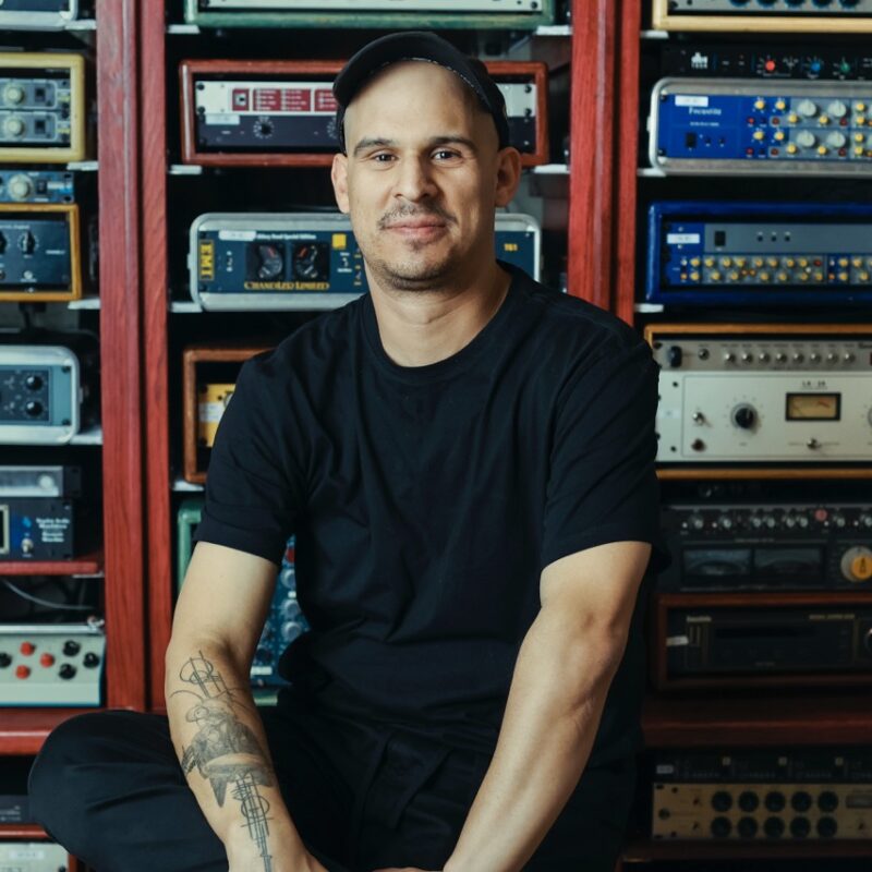 Justin Moshkevich at Igloo Music in front of outboard gear. Photo credit by David Vega