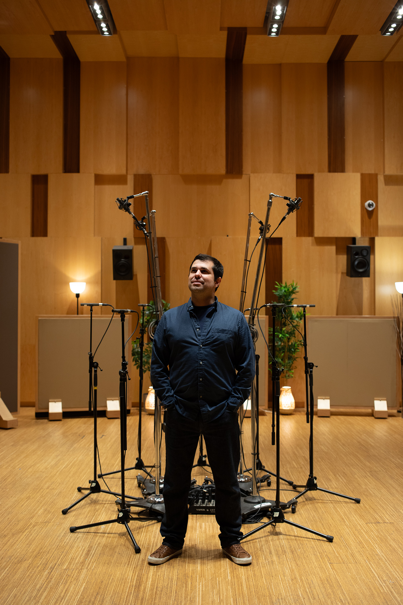Immersive engineer standing in front of a microphone array at Humber College, Toronto, where he recorded his "Immersed" album.