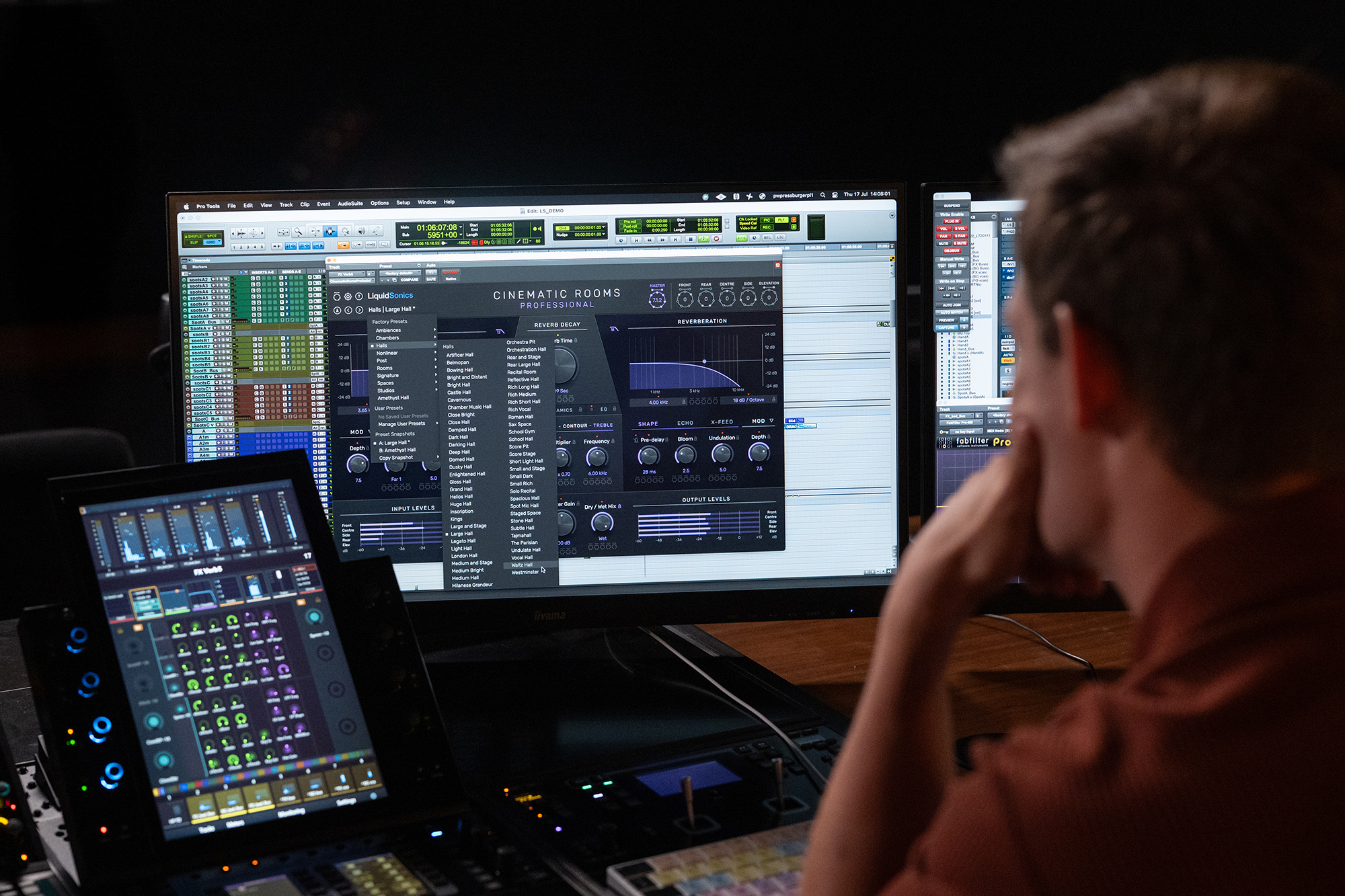 Senior mix technician Fergus Pateman looking at the GUI of Cinematic Rooms Professional