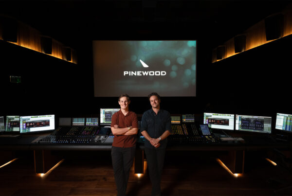 Pinewood's Fergus Pateman and Jasper Thorn in front of a mixing console at the Pressburger Theatre.