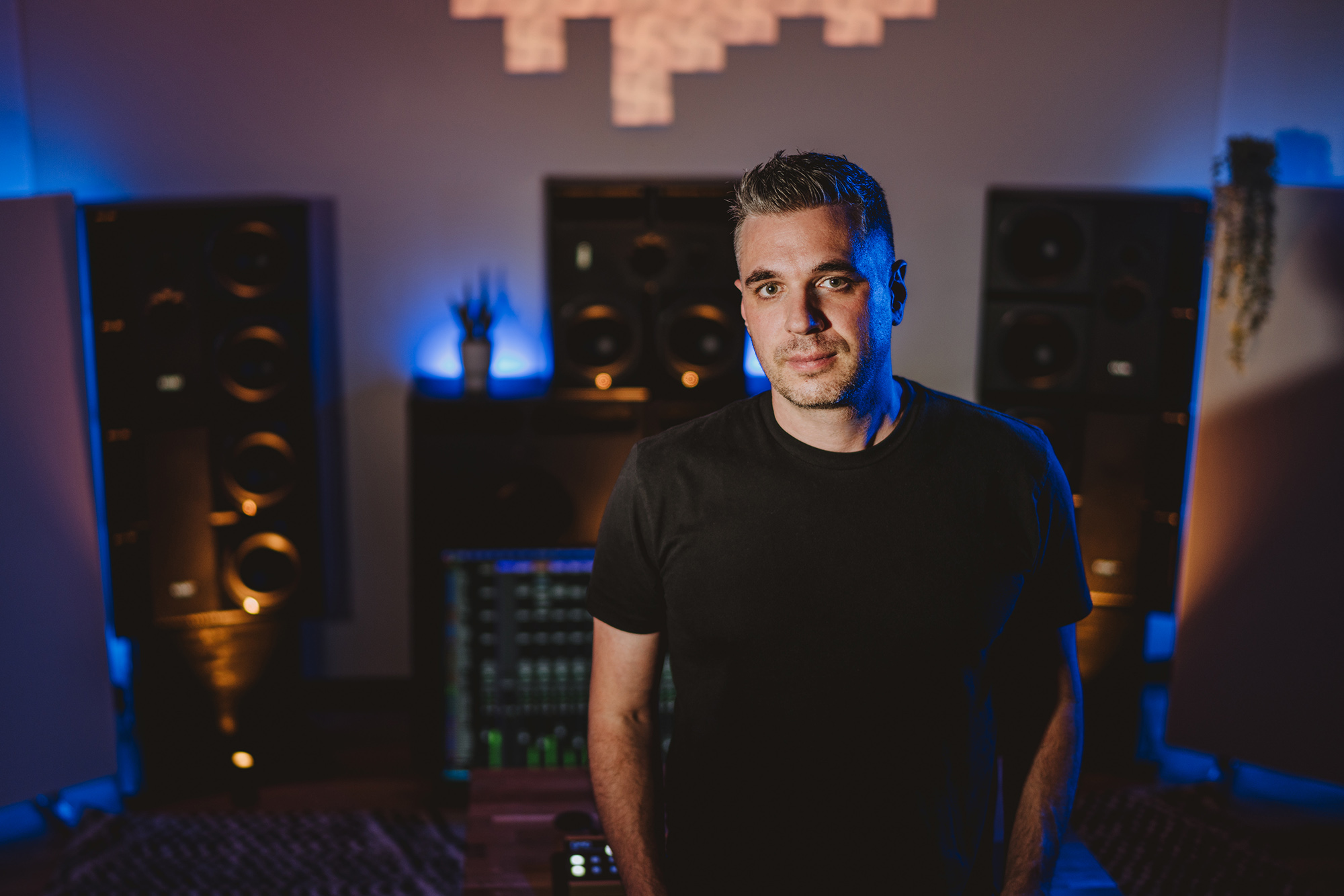 Mixing engineer Sam Polizzi at his studio, looking into the camera